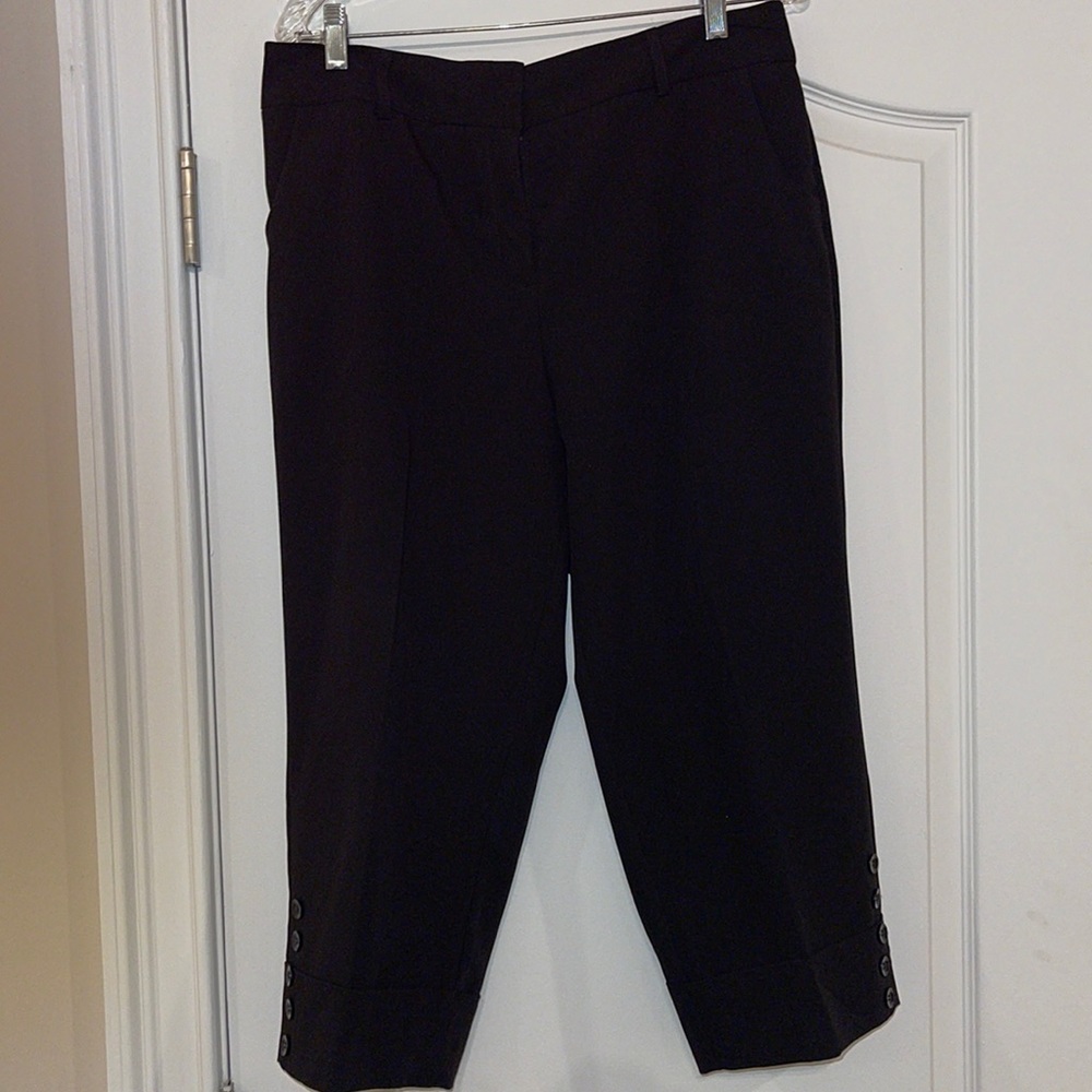 Black capris dress pants with cuff bottom and decorative buttons. Never worn